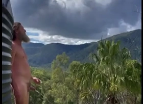 Naked Christian pissing outdoors on the ridge with mountain views. Peepee piss from Australian