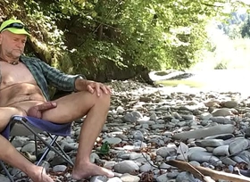 bear with beer bating in the nudist canyon