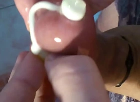 Put condom on sounded cock