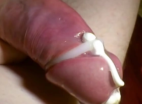Slowly playing beside sounded cock beside condom.