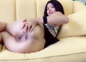 Asian Cute Explicit showcases off the brush shaved pussy increased by pees analogous to a fountain