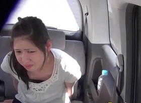 Asian pees in taxi cab