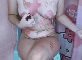 Asian girl drawing on their way naked body with lipstick